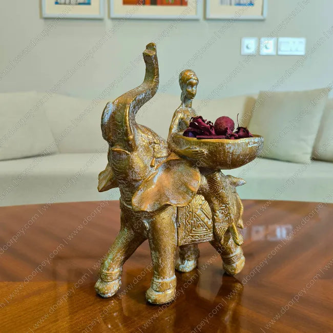 Detailed Savannah Empress Elephant Sculpture with an antique gold finish, a majestic resin elephant and female figure figurine perfect for luxury home decor styling.