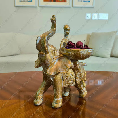 Detailed Savannah Empress Elephant Sculpture with an antique gold finish, a majestic resin elephant and female figure figurine perfect for luxury home decor styling.