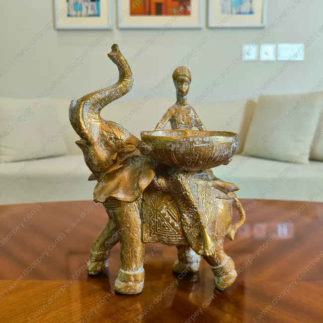 Detailed Savannah Empress Elephant Sculpture with a distressed antique gold finish for elegant home decor styling on console tables and shelves.