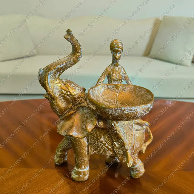 Regal Savannah Empress Elephant Sculpture with an antique gold finish for sophisticated home centerpiece decor.