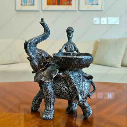 Detailed Savannah Empress Elephant Sculpture with an antique silver finish, a majestic resin elephant and female figure figurine perfect for luxury home decor styling.