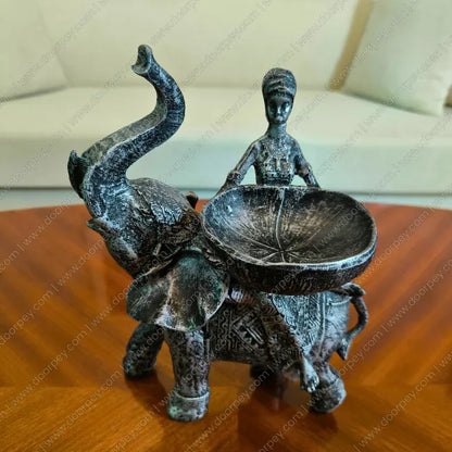 Detailed Savannah Empress Elephant Sculpture with an antique silver finish, a sophisticated resin figurine for luxury home decor styling.