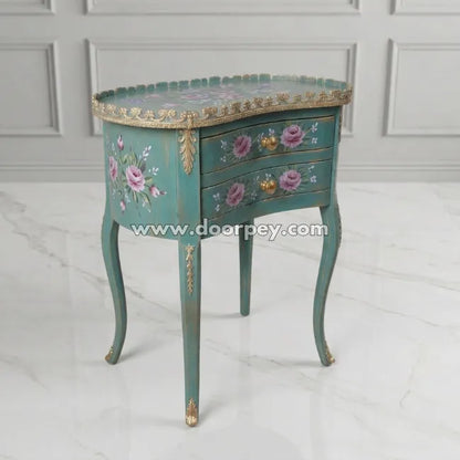 Decorative side table with floral patterns and gold accents on a white background