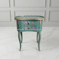 Decorative wooden end table with floral designs on a white background