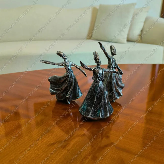 Detailed Whirling Dervish Resin Sculpture with an antique silver finish, a serene spiritual figurine capturing the Sufi dance for home decor styling.