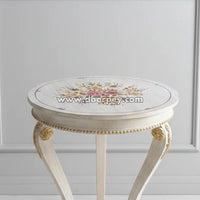 White round wooden side table featuring delicate hand painted floral design and classic curved legs