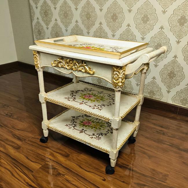Close-up of hand-painted floral designs on the sturdy Garden Elegance serving cart